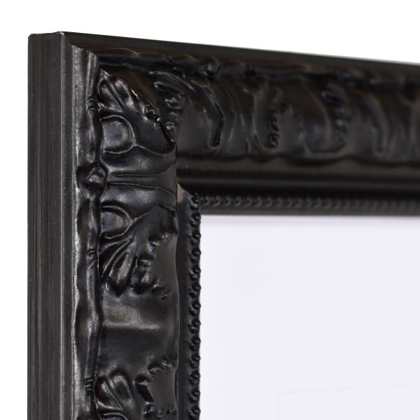 Ansicht der Ecke eines schwarzen Holzrahmens im eleganten, barocken Look mit Perlkante 