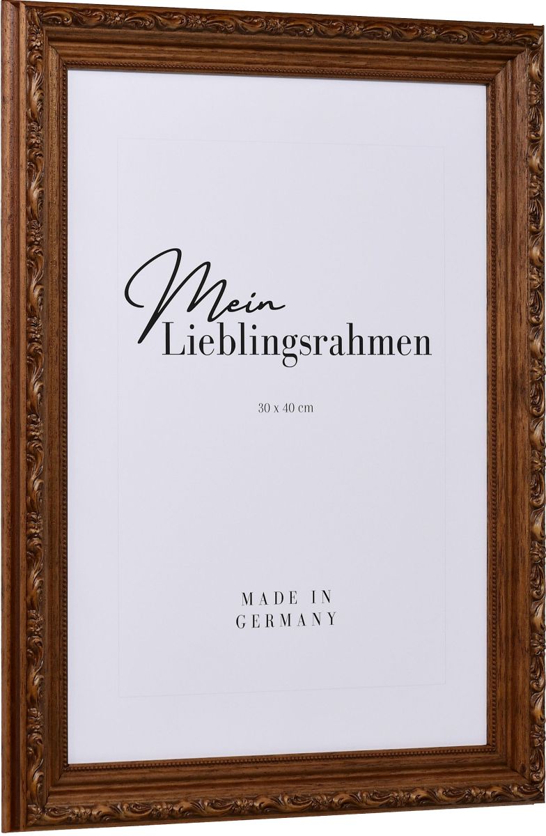Seitenansicht eines braunen Holzrahmens im Barockstil mit rustikaler, nussbaumgebeizter Oberfläche, leicht schimmernden floralen Ornamenten und einem Perlstab an der Innenkante